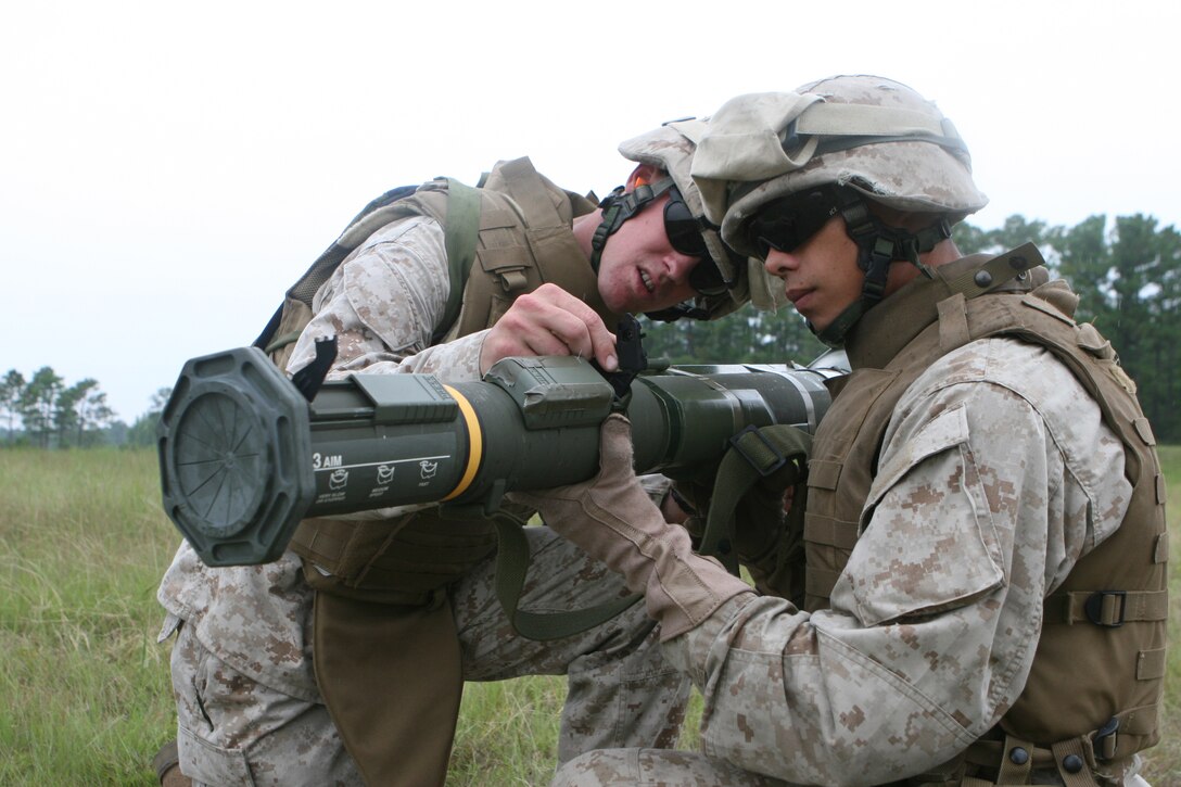 Pfc. Joshua Rentz, Pfc. Kyle Banks and Pvt. Edward Reixinger display the tattoos they got in honor of their friend Billy Foulke, who was killed in a car accident last summer.