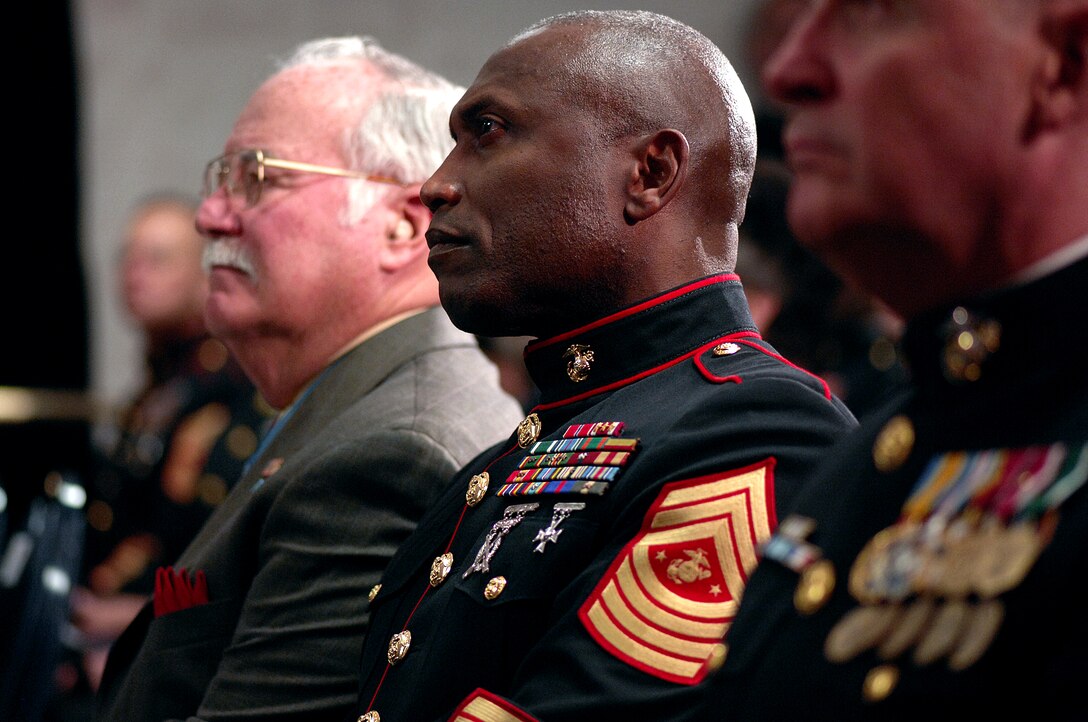 Sgt. Maj. of the Marine Corps John. L. Estrada listens during the ceremony posthumously inducting U.S. Marine Corps Cpl. Jason L. Dunham into the Pentagon Hall of Heroes, Jan. 12, 2007. Dunham was critically injured in Iraq when he jumped on a grenade to save the lives of others.