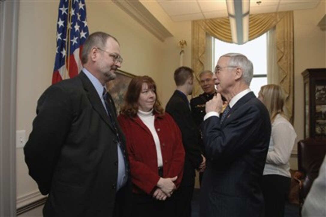 Deputy Secretary of Defense Gordon England (right) speaks with Dan and Deb Dunham, the parents of U.S. Marine Corps Cpl. Jason Dunham, in his Pentagon office on Jan. 12, 2007.  Cpl. Dunham received the Medal of Honor posthumously for his heroic actions in Iraq.  Dunham gave his life in April 2004 by jumping on a grenade during an insurgent attack in western Iraq saving the lives of Marines under his command.  