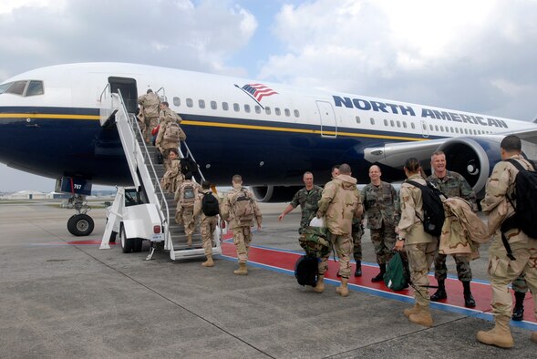 Airmen from Kadena Air Base, Japan, embark Jan. 8 on a commercial aircraft for transport to support the war on terrorism. More than 600 Kadena members are deploying to various locations in the U.S. Central Command's area of responsibility. (U.S. Air Force photo/Airman 1st Class Sheila deVera)