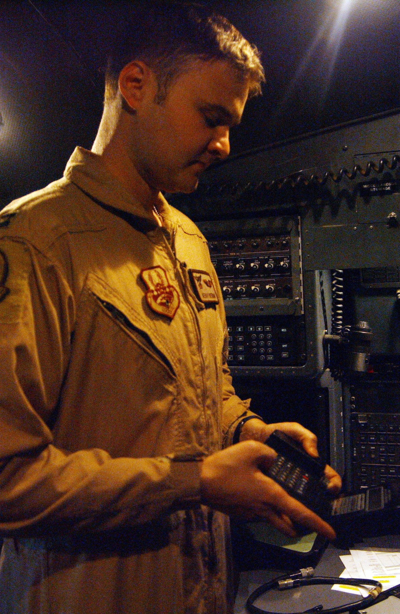 BALAD AIR BASE, Iraq -- Capt. Kenny Bierman 777th Expeditionary Airlift Squadron C-130 Hercules navigator, conducts pre-flight checks on his navigation equipment prior to a hub-and-spoke mission Jan. 8. Captain Bierman is deployed from Little Rock Air Force Base Ark. (U.S. Air Force photo by Senior Airman Josh Moshier)                                 