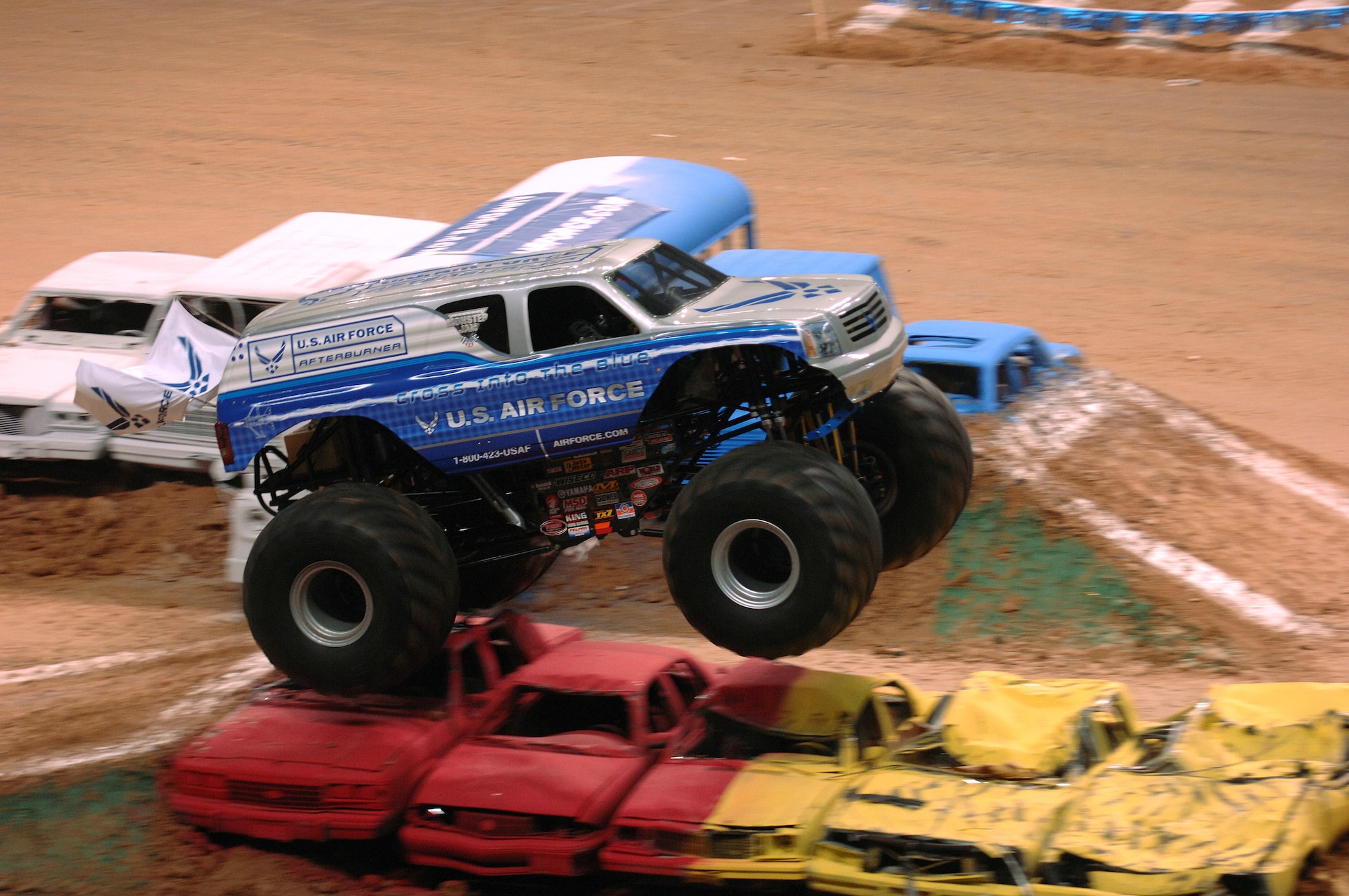 The Air Force sponsored monster truck Afterburner, driven by Damon Bradshaw, soars over an obstacle during the qualifying round of the 2007 Monster Jam in San Antonio, Texas. (US Air Force photo/Master Sgt. Scott Reed)