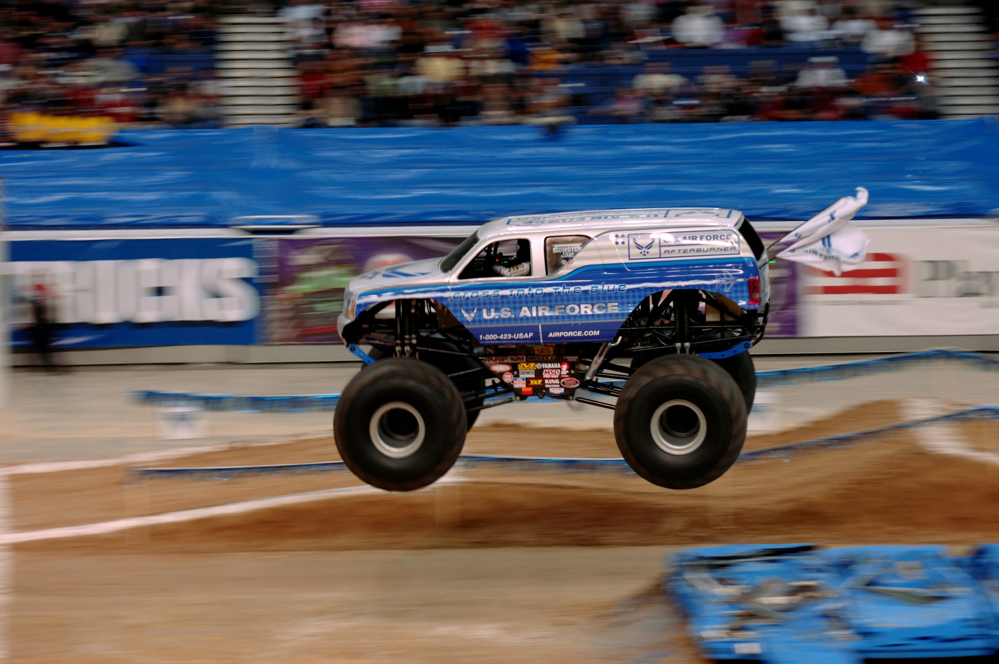 The Air Force sponsored monster truck Afterburner, driven by Damon Bradshaw, goes airborne over an obstacle during the free style round of the 2007 Monster Jam in San Antonio, Texas. (US Air Force photo/Master Sgt. Scott Reed)