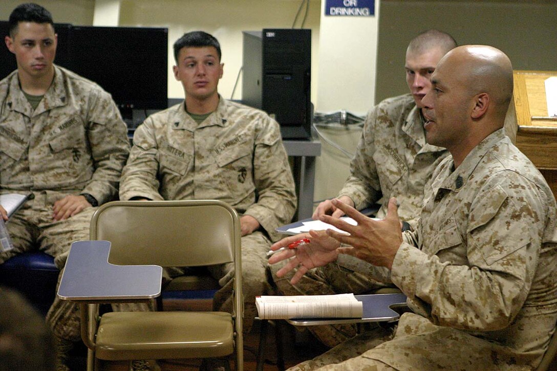 ABOARD USS BOXER (LHD 4) (April 28, 2007) -- Master Sgt Patrick L. Gallegos, headquarters commandant,15th Marine Expeditionary Unit (Special Operations Capable) instructs the students in his business management course in a classroom aboard the USS Boxer (LHD 4). Off-duty education courses are open to all Marines aboard the USS Boxer (LHD 4) during the transit from the Arabian Gulf Region to Camp Pendleton, Calif after a twice extended Western Pacific deployment that began in Sept 2006. The 15th Marine Expeditionary Unit (Special Operations Capable), a part of Amphibious Ready Group 5, is currently deployed aboard the USS Boxer (LHD 4), USS Dubuque (LPD 8), and USS Comstock (LSD 45).