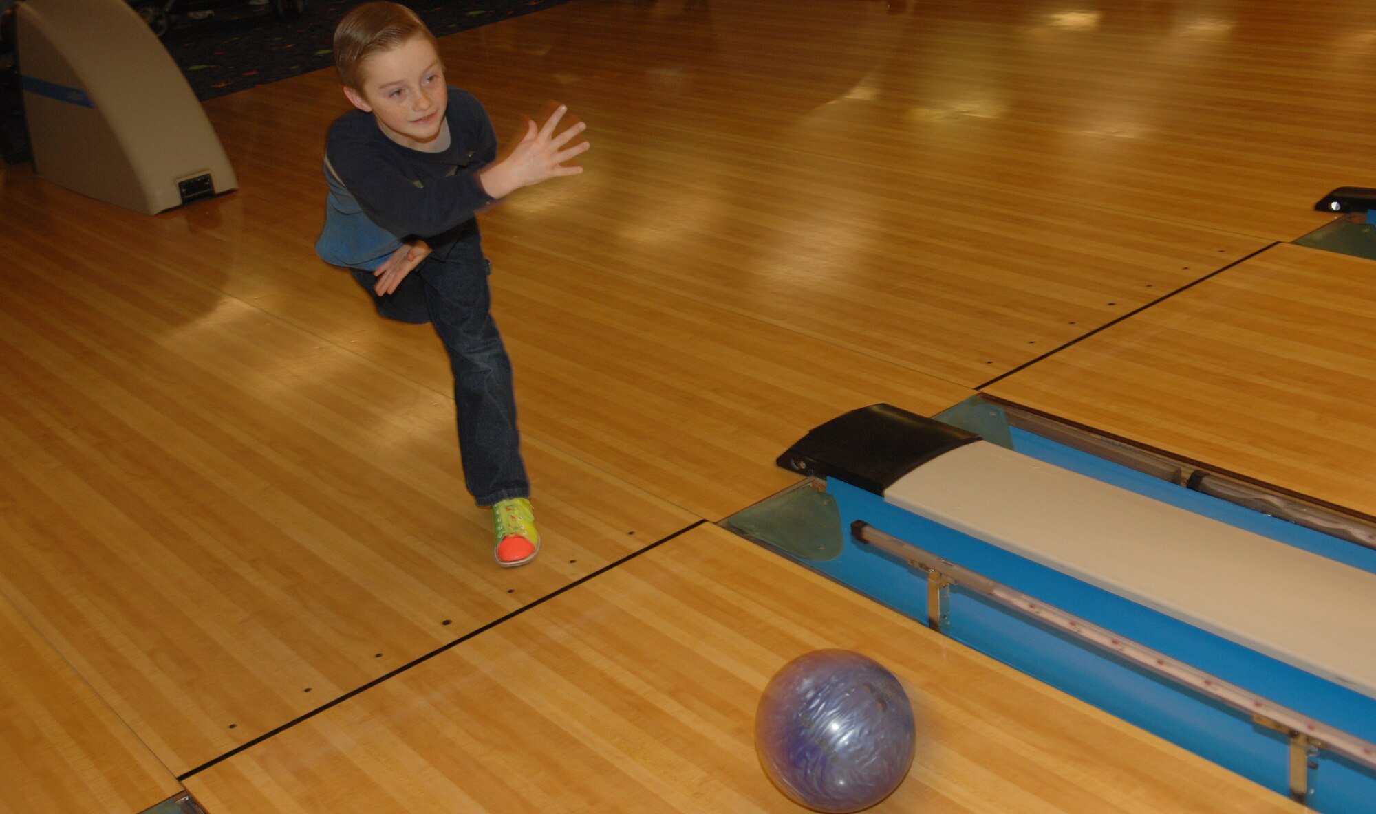 MINOT AIR FORCE BASE, N.D. -- Kevin Tims, son of Col. Gregory Tims, 91st Operations Group commander, rolls his ball down the lane during “Kids bowl for Free Day” at Rough Rider Lanes Jan. 16. “Kids bowl for Free Day” is part of the 5th Services Squadron customer appreciation days to thank Minot Air Force Base members for all their support they have provided the past year. (U.S. Air Force photo by Airman 1st Class Cassandra Butler)