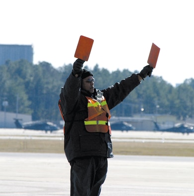 743rd Aircraft Maintenance Squadron members taxi in aircraft when they arrive on the Pope flightline. This is part of the duties of a transient alert member.