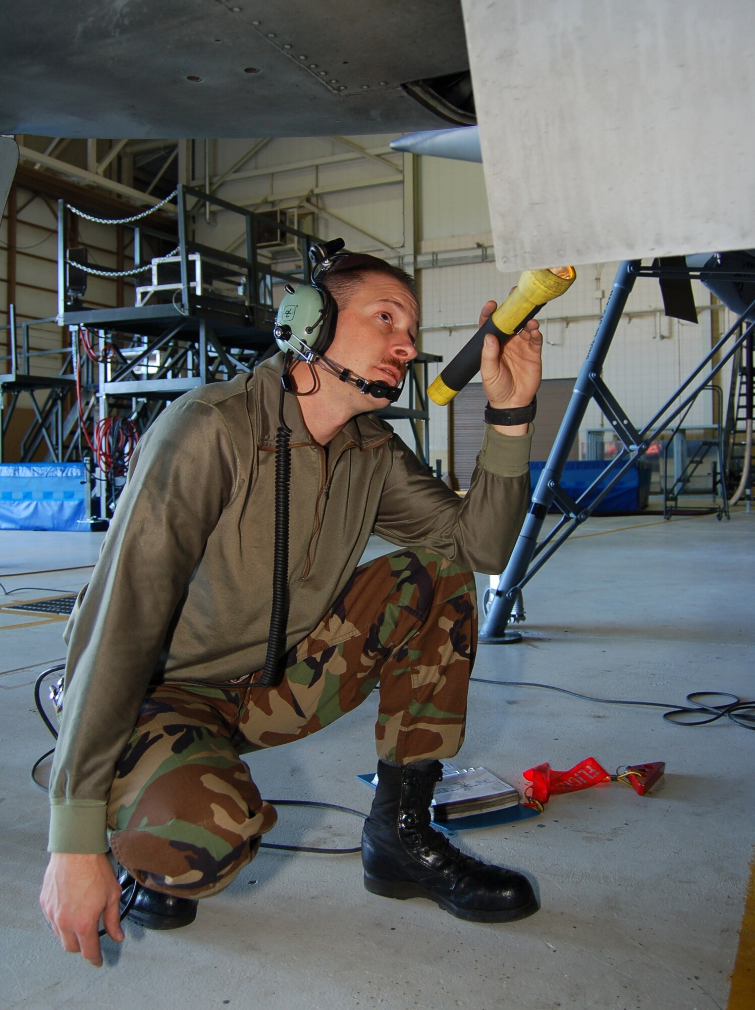 Staff Sgt. Jay Williams, crash recovery specialist with the 723rd AMXS, inspects the landing gear of an HC-130P as it retracts during an isocronal maintenance inspection Jan., 8 2007 (U.S. Air Force photo by Tech Sgt. Parker Gyokeres)