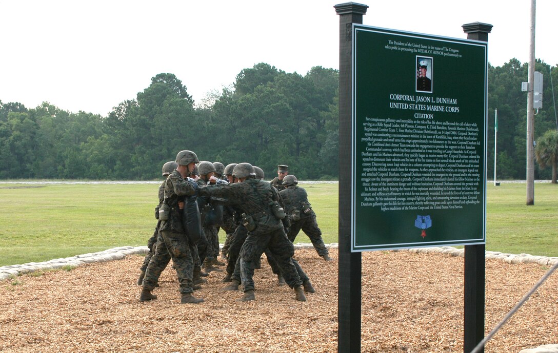 Recruits of Platoon 3064, Kilo Company, 3rd Recruit Training Battalion, demonstrate the warrior's station, Dunham's Defense, at the dedication ceremony held Aug. 16 on Parris Island. At Dunham's Defense, recruits will read Dunham's Medal of Honor citation, and then perform ground-fighting techniques taught throughout the Marine Corps Martial Arts Program. These techniques will reflect those Dunham used to defend himself and his fellow Marines on the day which led to his nomination for the Medal of Honor.