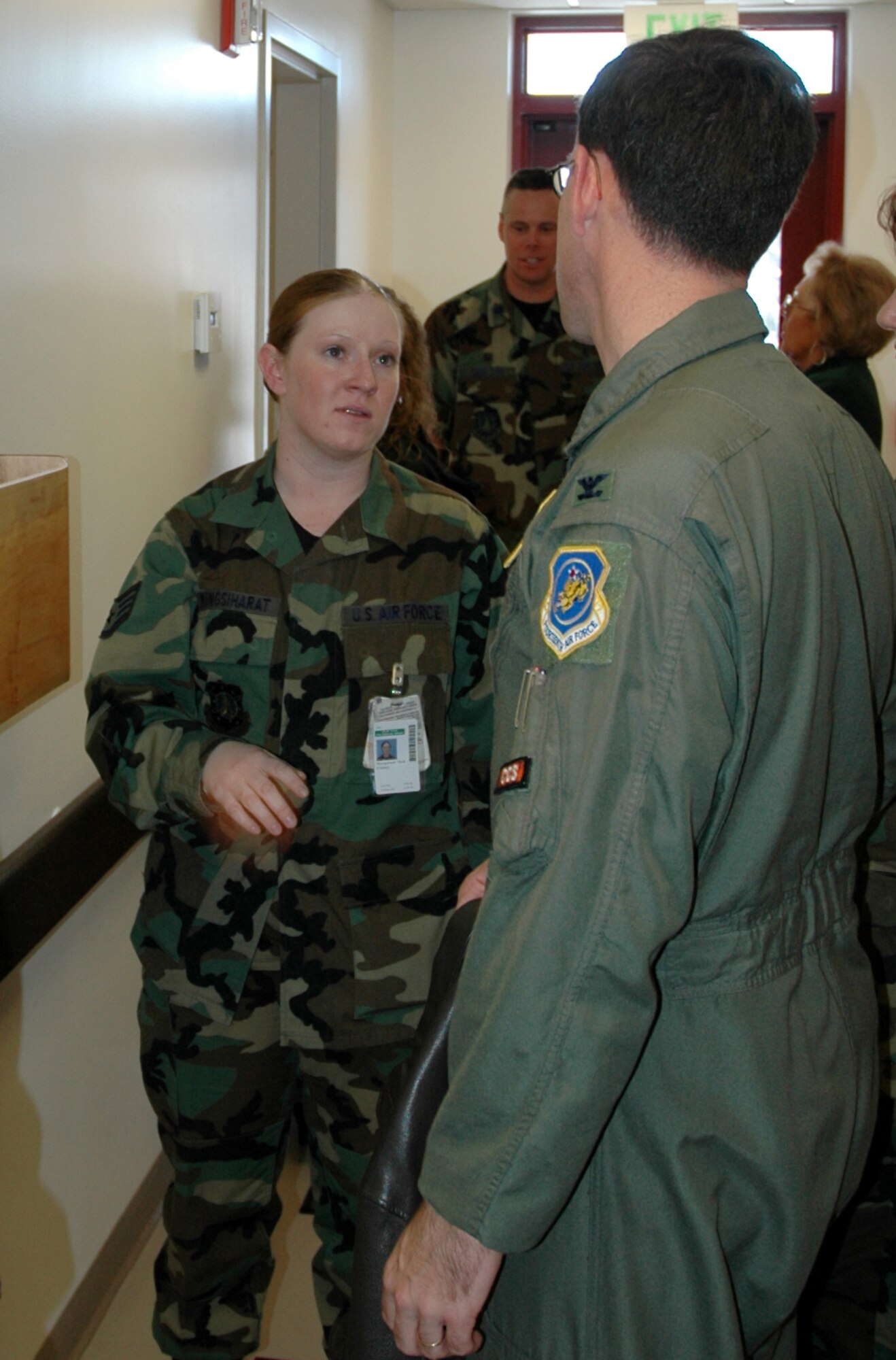 Staff Sgt. Paula Moungsiharat, a medical technician with the 21st Medical Operations Squadron, explains features of the expanded family practice clinic to Col. Stephen Tanous, 21st Space Wing vice commander. The clinic officially opened the new area with a ribbon cutting Jan. 17. The $500,000 expansion has room for two more doctors and four patient exam rooms. (U.S. Air Force photo by Steve Brady)