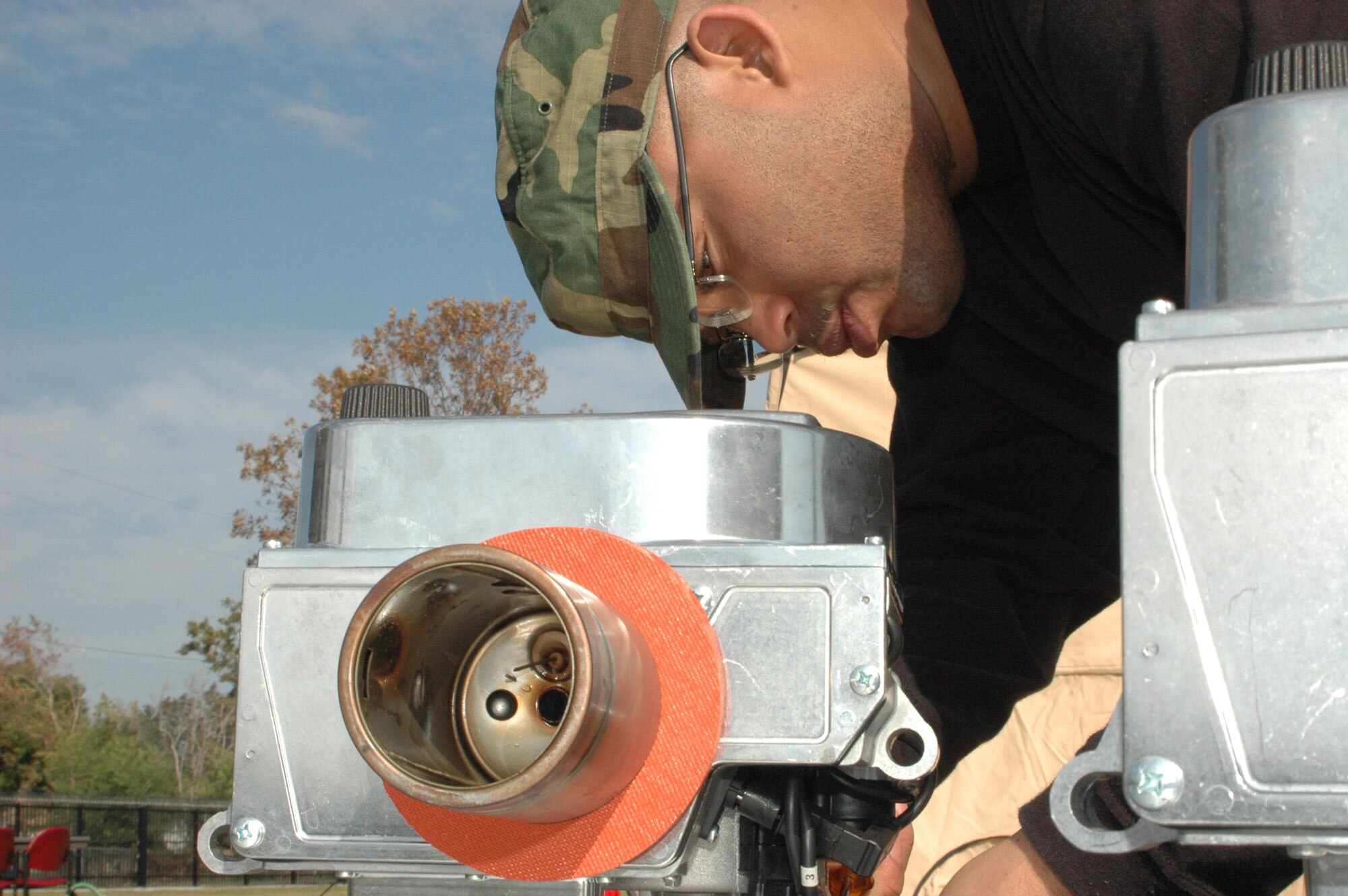 New to the Services stable of field gear is the Babington Burner. This multi-purpose burner is safer and more easy to use than equipment of the past. Senior Airman A. Z. McKenzie, 403rd Wing Services specialist, prepares the burner for startup. (U.S. Air Force Photo By Airman 1st Class Tabitha Spinks)