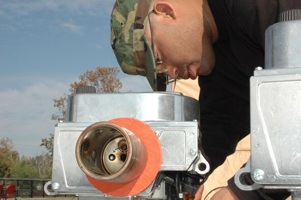 New to the Services stable of field gear is the Babington Burner. This multi-purpose burner is safer and more easy to use than equipment of the past. Senior Airman A. Z. McKenzie, 403rd Wing Services specialist, prepares the burner for startup. (U.S. Air Force Photo By Airman 1st Class Tabitha Spinks)