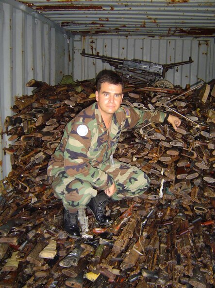 (Courtesy photo) Major Jara collects arms and ammunition from local combatants.