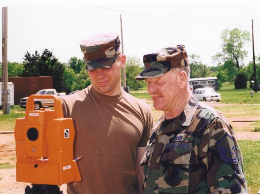 Master Sergeant William Dean, right, instructs a fellow civil engineer during a training exercise off base.