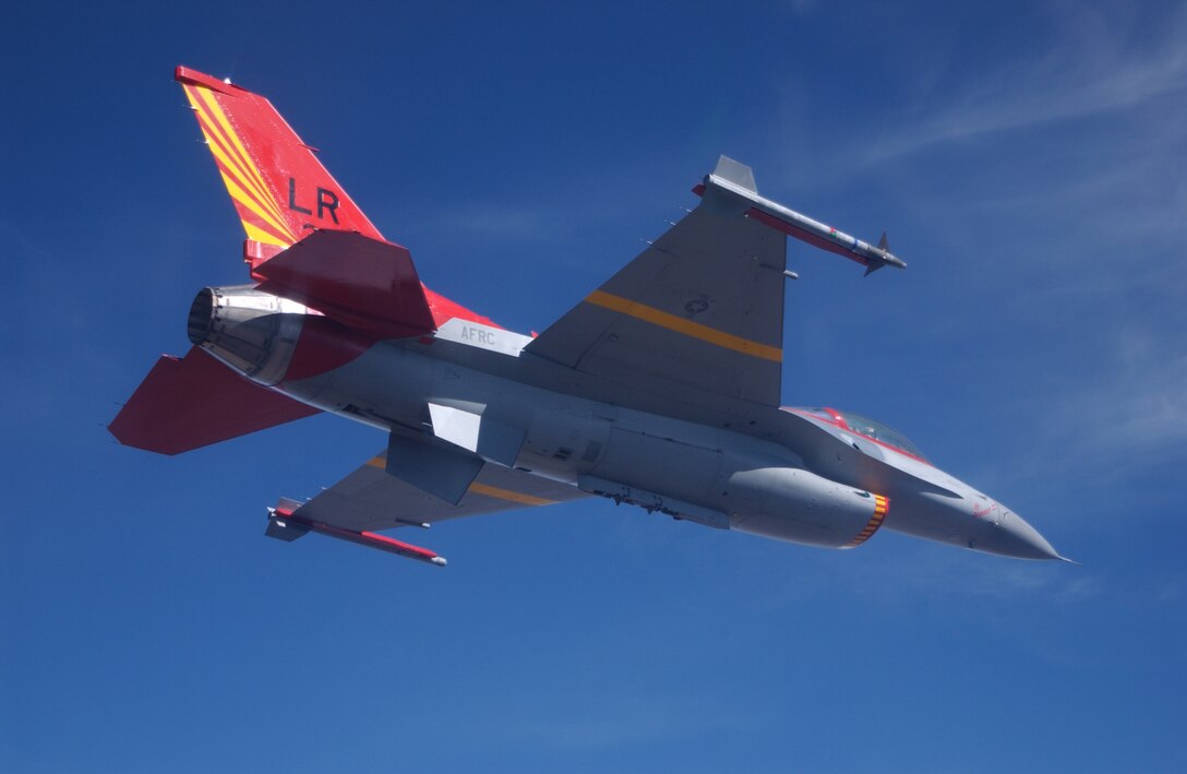 Maj. Robert Churchill, 302nd Fighter Squadron, flies an F-16 Viper painted to commemorate the Tuskegee Airmen of World War II. (U.S. Air Force photo/Tech. Sgt. Lee Harshman)