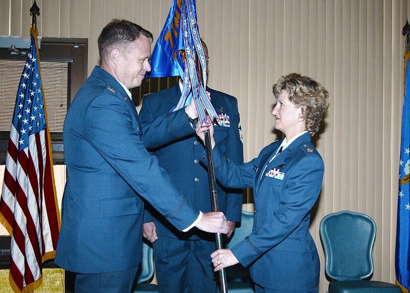 (Photo by Terry Wasson) Major Astrachan accepts command of the squadron from Col Fred Cheney, 71st Mission Support Group commander.