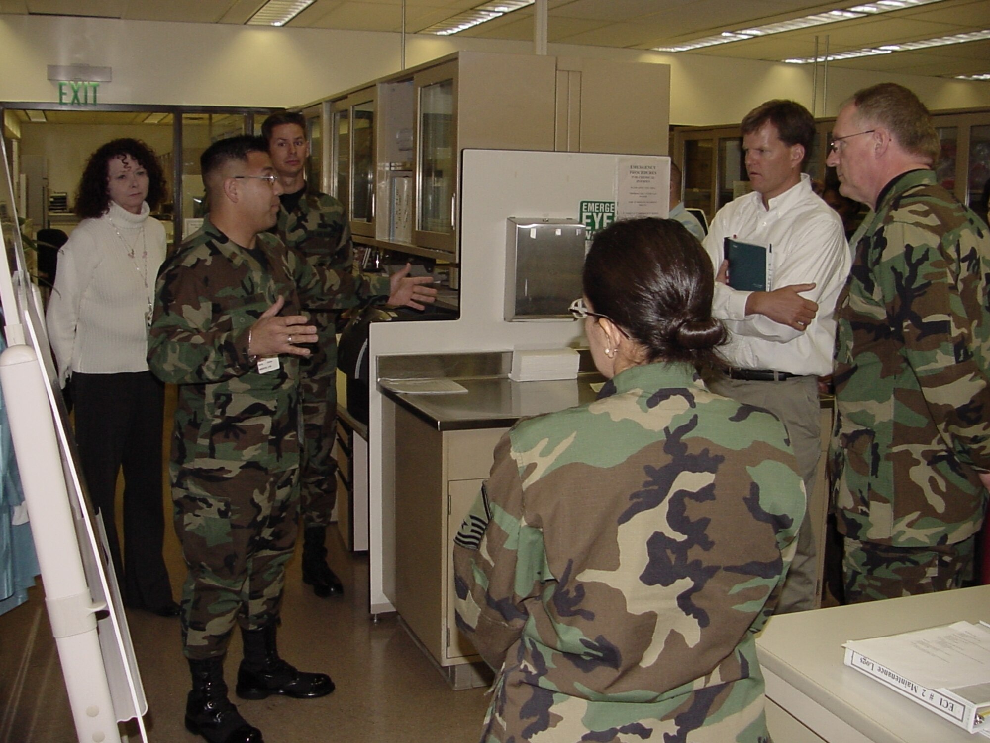 2nd Lt. Carlos Doria, 60th Diagnostics and Therapeutics Squadron deputy chief of the Core Lab, briefs Dr. Ron Ritter, the Special Assistant for Air Force Smart Operations to the Secretary of the Air Force, and Deputy Director of the Air Force Smart Operations Office, Washington, D.C., on planned laboratory remodeling in support of AFSO 21 at the David Grant USAF Medical Center Jan. 12. Dr. Ritter also visited the 60th Aerial Port Squadron and briefed senior leadership about how they can get the AFSO 21 message to their Travis Airmen. (U.S. Air Force photo by Jim Spellman)