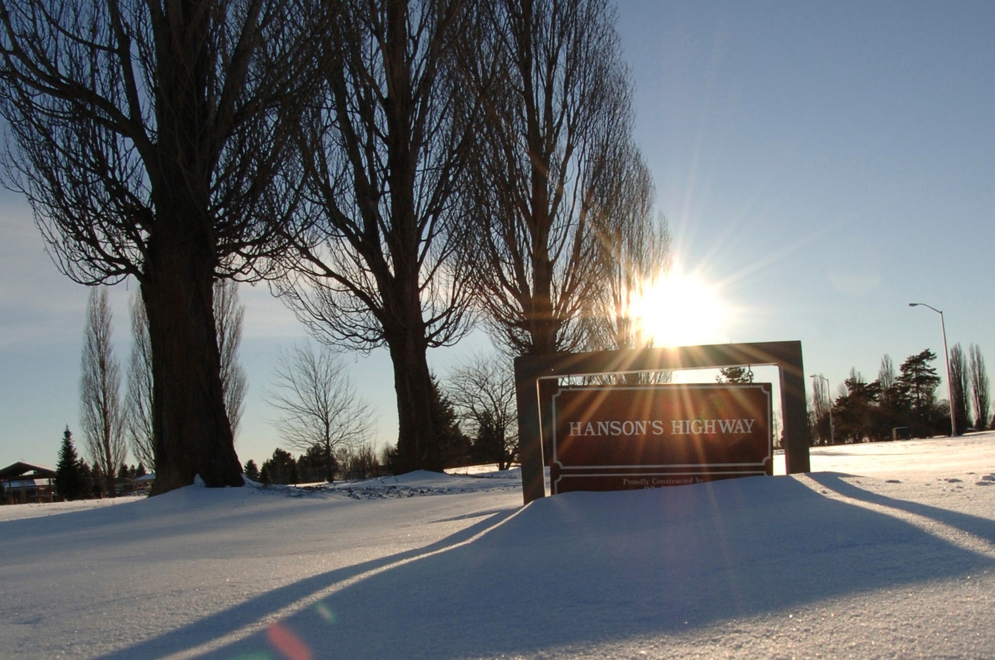 The sun peeks over the hill near Hanson's Highway. Over the past week, Fairchild has received a layer of snow that has blanketed the entire base in white.
