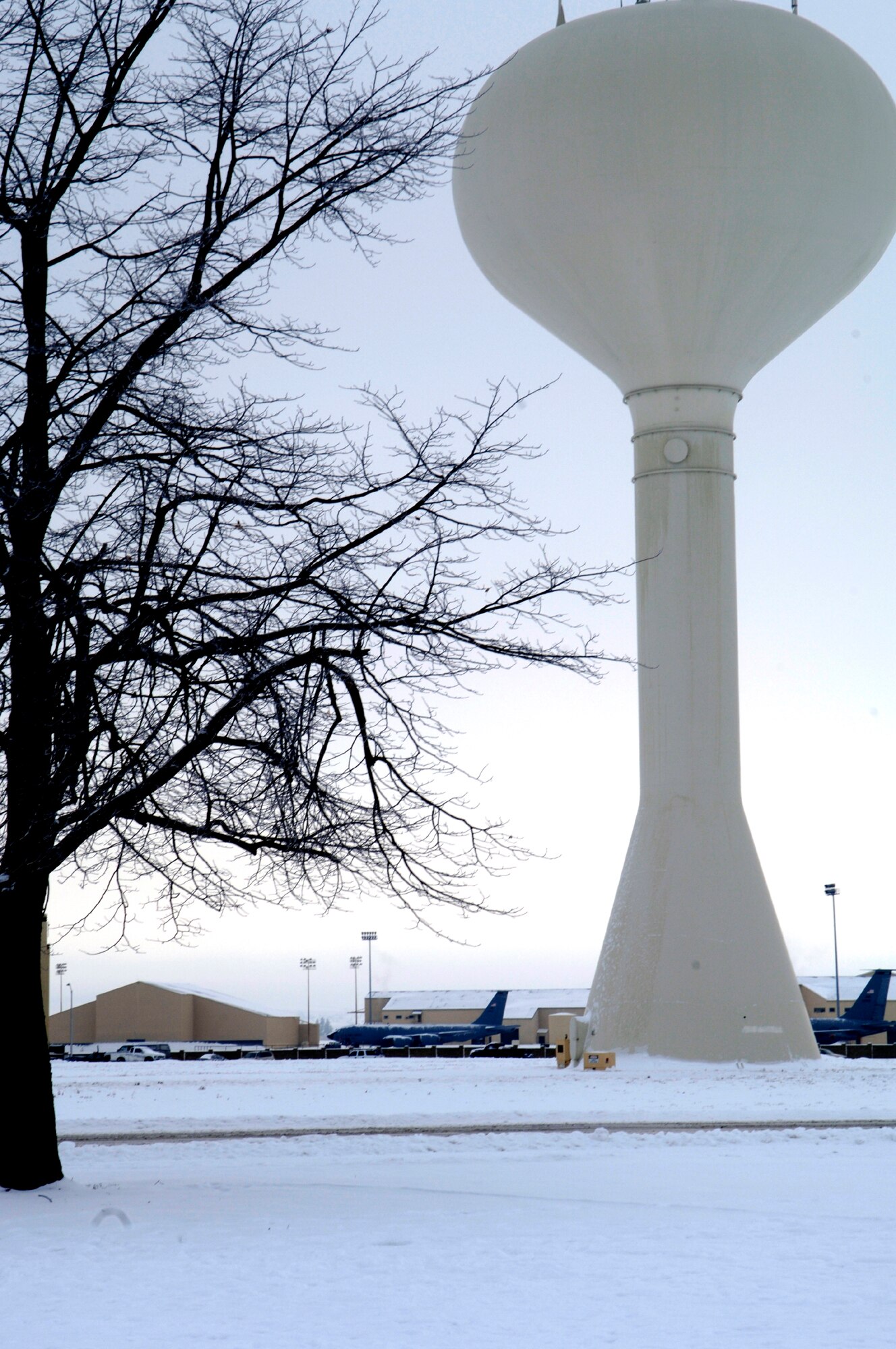 KC-135 Stratotankers sit on the runway behind the Fairchild water tower. Over the past week, Fairchild has received a layer of snow that has blanketed the entire base in white.