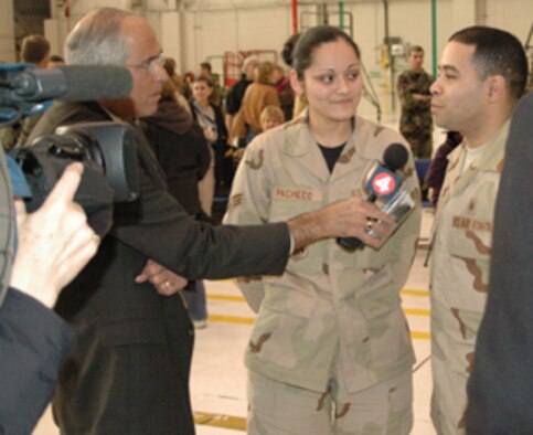 NIAGARA FALLS AIR RESERVE STATION, N.Y.- Senior Airman Alexander Pacheco, & wife Senior Airman Marianela Pacheco, both medical techinicians with the 914th AeroMedical Staging Squadron answer a few questions for local media reporters about their deployment to Iraq.  Both husband and wife will be deployed in support of Operation Iraqi Freedom to the same location where they will be helping treat wounded soliders and civilians.  (U.S. Air Force photo/Tech. Sgt. Kevin Nichols)