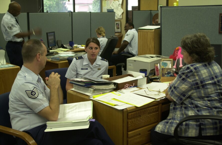(Photo by A1C Jennifer Jackson) (Center) 2nd Lt Sarah Dauer, relocations and employment chief, and Linda Pallitto, separations and retirements, 71st Military Personnel Flight (right), answer questions posed by TSgt Paul Brunelle, Air Education and Training MPF management inspector during a Staff Assistance Visit Wednesday. A nine-person evaluation team assessed the squadron’s programs to prepare for the Operational Readiness Inspection next year.