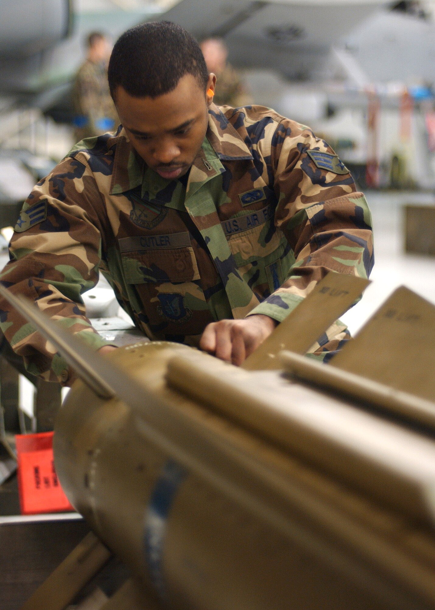 Senior Airman Corneilius Cutler prepares an air-to-ground missile to be loaded onto an F-16 Fighting Falcon during the Weapons Standardization Load Crew of the Year Competition Jan. 11at Eielson Air Force Base, Alaska . The competition evaluates technical proficiency, safety procedures and overall time. Airman Cutler is assigned to the 18th Aircraft Maintenance Unit. The 18th AMU's overall time was 56 minutes and 37 seconds. (U.S. Air Force photo/Airman Jonathan Snyder)