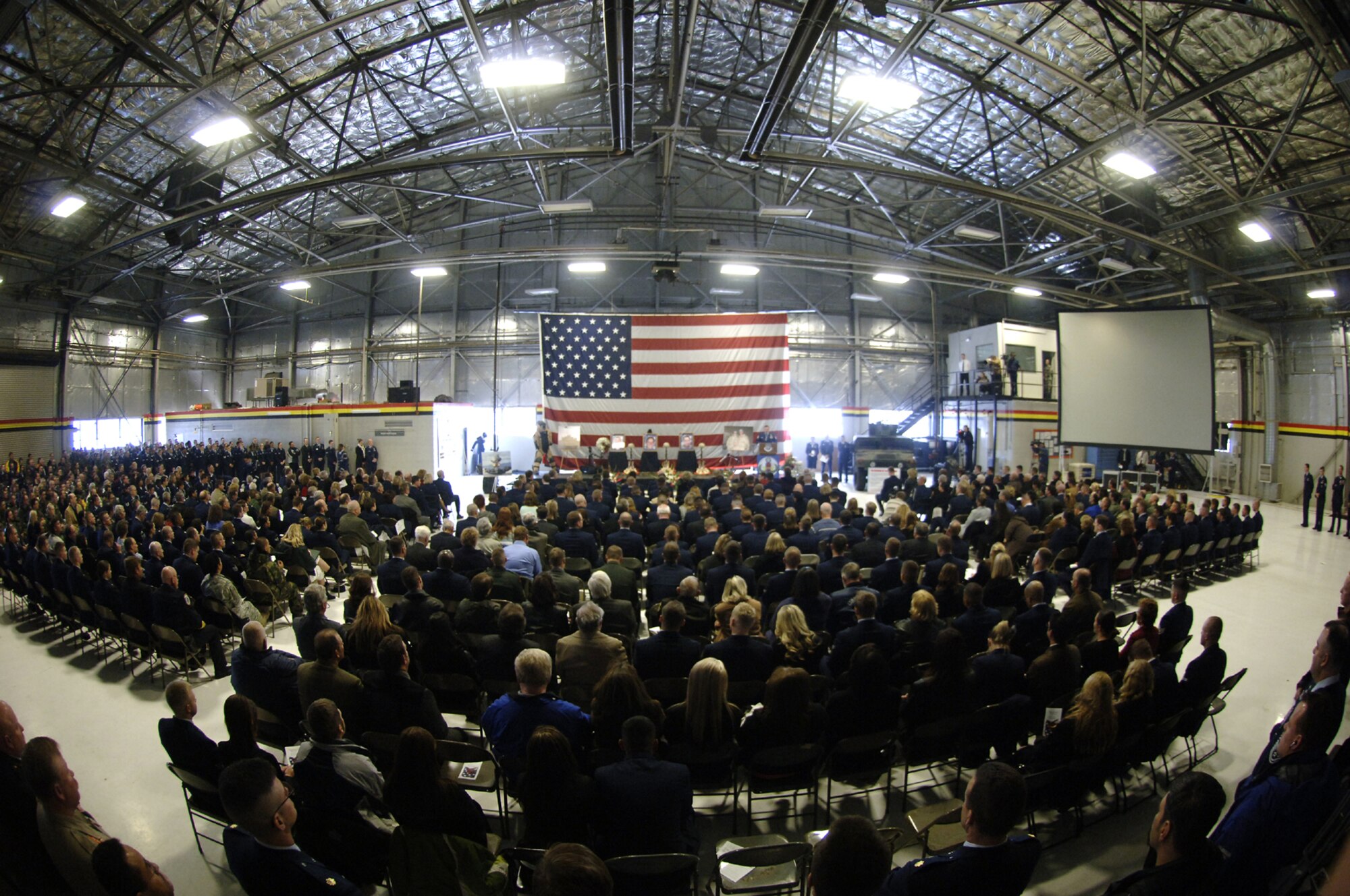 Attendees filled a hangar during a Memorial Service held Friday at Hill AFB for three killed in Iraq.  The three Airmen were members of the 775th Civil Engineer Squadron’s Explosive Ordnance Disposal Flight. 