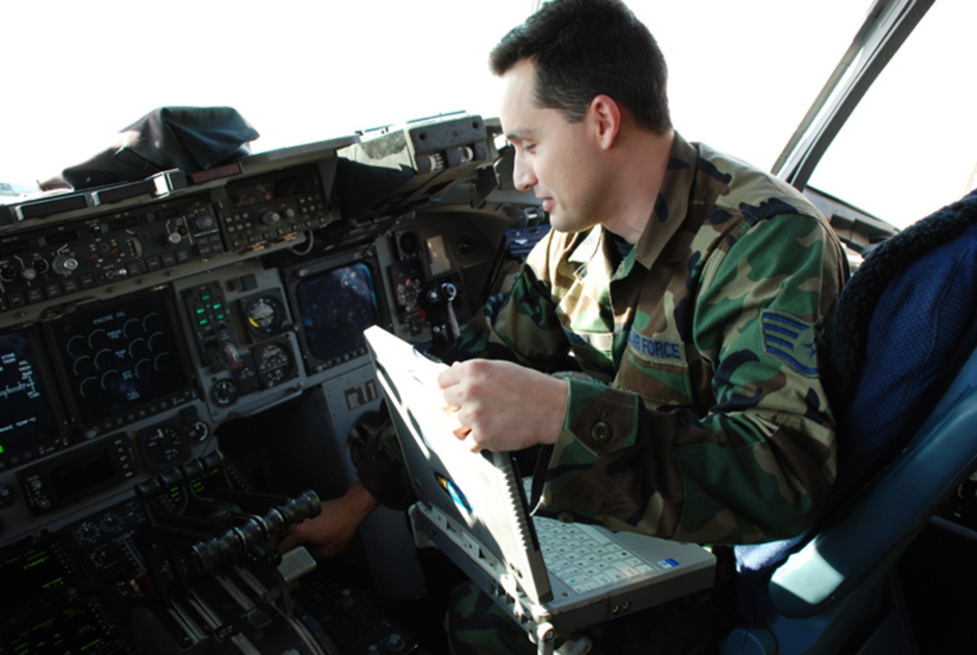 Staff Sgt. Brian Busby, a guidance and control jouneyman assigned to the 315th Aircraft Maintenance Squadron, checks for malfunctions of autoflight avionics systems on the C-17 Globemaster III.