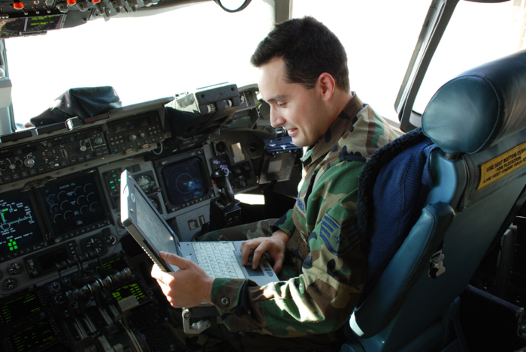 Staff Sgt. Brian Busby, a guidance and control jouneyman assigned to the 315th Aircraft Maintenance Squadron, checks for malfunctions of autoflight avionics systems on the C-17 Globemaster III.
