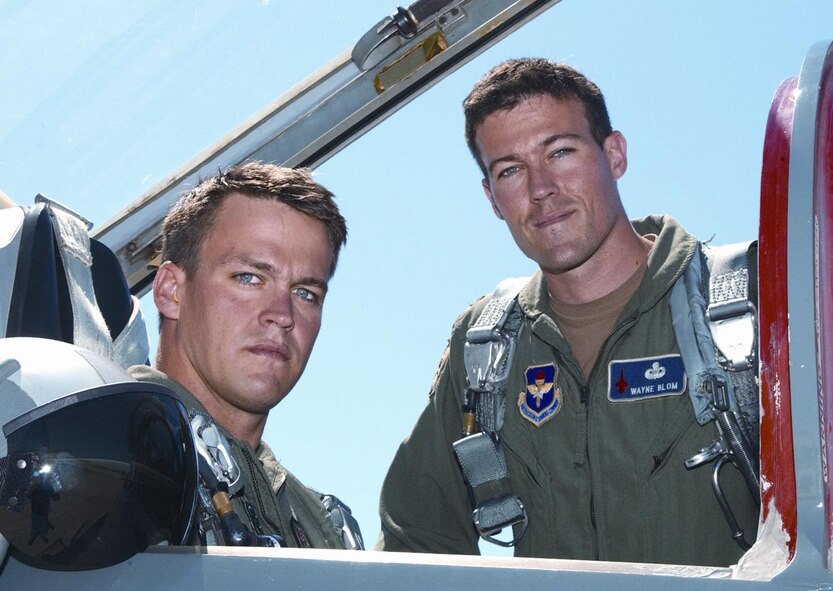 (Photo by Terry Wasson) TSgt Erik Blom (left) settles into the T-38 cockpit for an incentive flight Wednesday arranged by his brother 2nd Lt Wayne Blom, of Class 04-13.