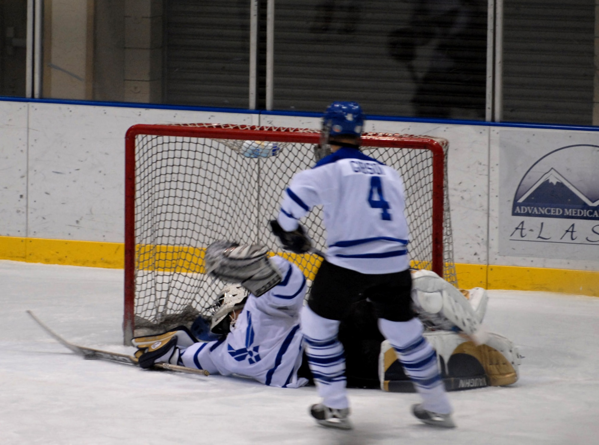 Chris Schaffer of the Eielson Air Force Base Icemen blocks the puck from going into the goal Jan. 13 at the Big Dipper Ice Arena in Fairbanks, Alaska. Eielson Icemen from Eielson Air Force Base, Alaska, faced off against the Fort Wainwright Grizzlies in the 11th Annual Interior Alaska Armed Forces Ice Hockey Commander's Cup Game. Eielson Icemen went on to win the game 8 to 6. (U.S. Air Force photo/Airman Jonathan Snyder)
