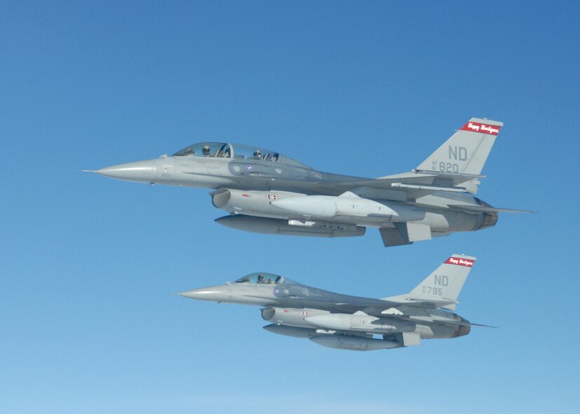 A Grand Forks AFB KC-135 refueled F-16s from the 119th Fighter Wing in Fargo, N.D., during a ceremony  Jan. 16 marking the end of the unit’s fighter mission.  (photo/Maj.John Kruczynski)