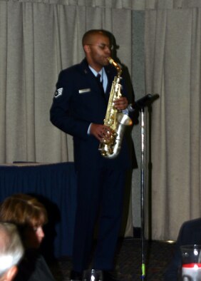 Staff Sgt. Talferd Collins, 365th Training Squadron, performs a saxophone solo at the MLK luncheon Jan. 12 at the Sheppard Club. (U.S. Air Force photo/Airman 1st Class Jacob Corbin.)