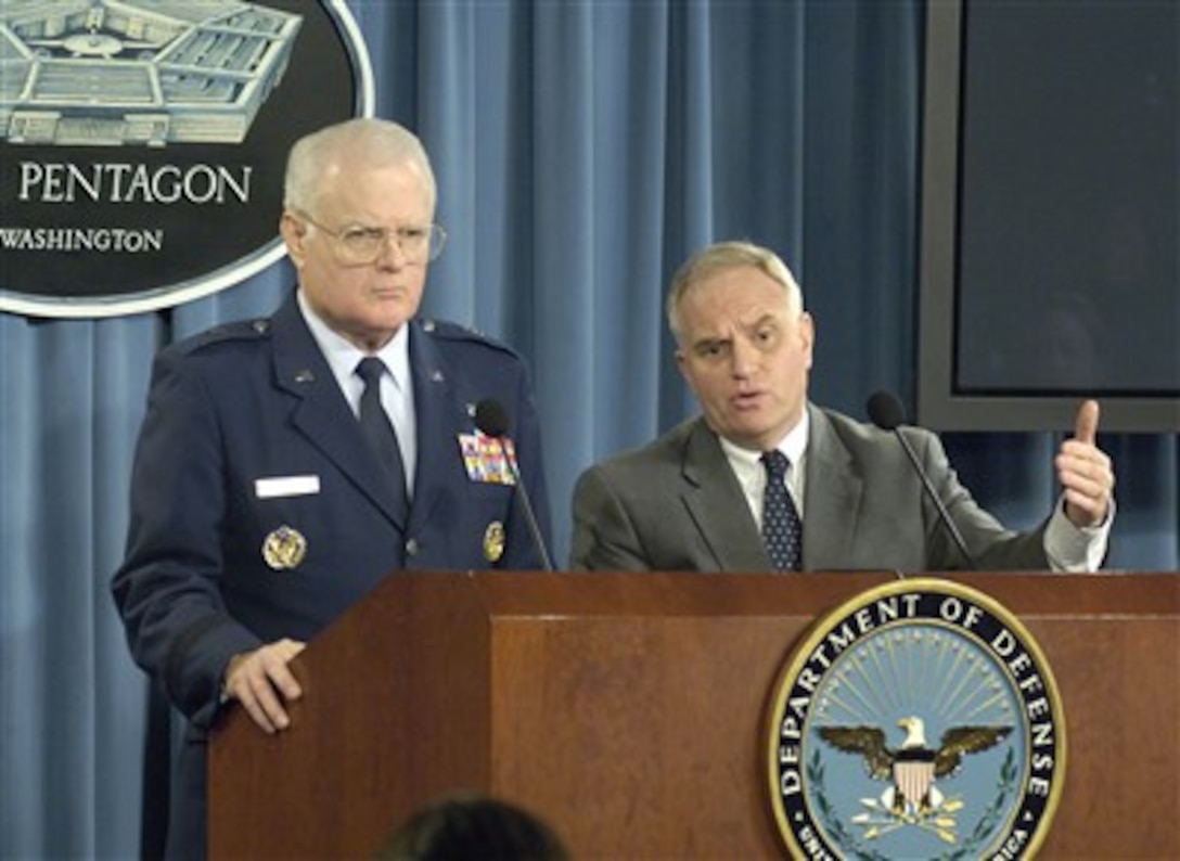 Special Legal Advisor to the Office of Military Commissions Brig. Gen. Thomas Hemmingway (left), U.S. Air Force, and Principal Deputy General Counsel Dan Dell'Orto (right) brief reporters in the Pentagon on new rules governing the conduct of military commissions used to try detainees in the global war on terrorism on Jan. 18, 2007.  