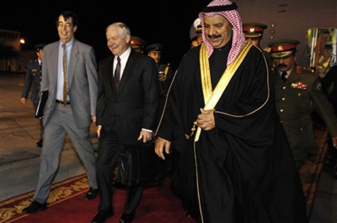 Defense Secretary Robert Gates talks with General Shaikh Khalifa bin Ahmed Al-Khalifa, deputy commander-in-chief and minister of defense, Bahrain Defense Force, and U.S. Ambassador to Bahrain William T. Monroe upon his arrival in Bahrain, Jan. 17, 2007.  