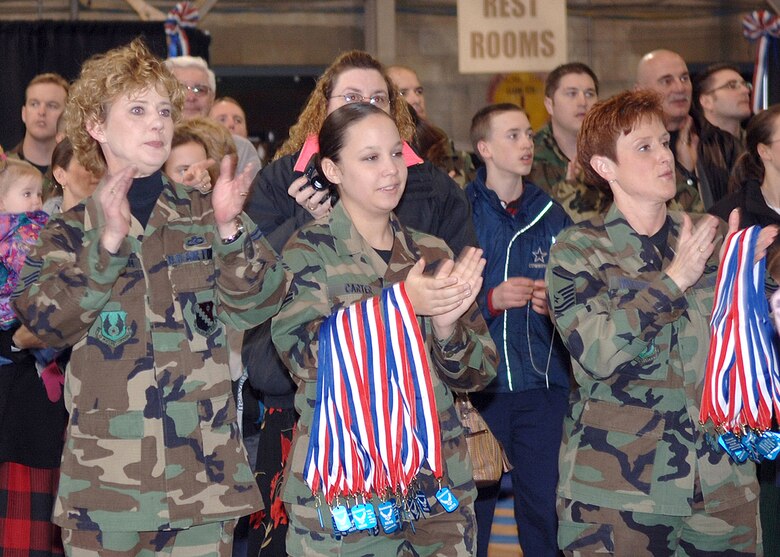 Base personnel and family members applaud recently returned deployers during the Hereos' Homecoming at Hanscom Air Force Base, Mass., Jan. 19. (U.S. Air Force photo/Jan Abate)