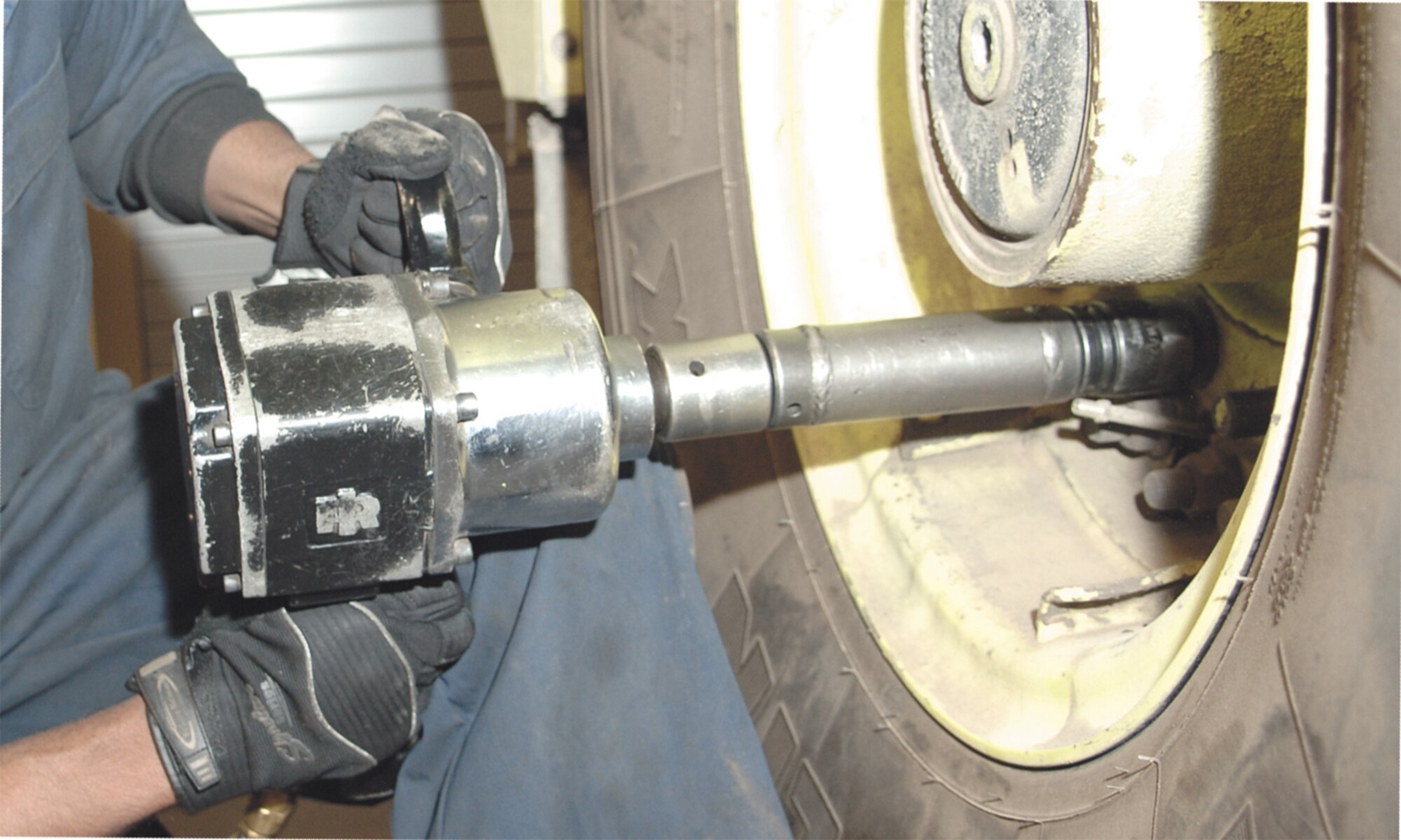 An Airman takes the bolts off the wheel of a fire truck for further
inspection of the vehicle. (U.S. Air Force Photo/Senior Airman Travis Edwards)