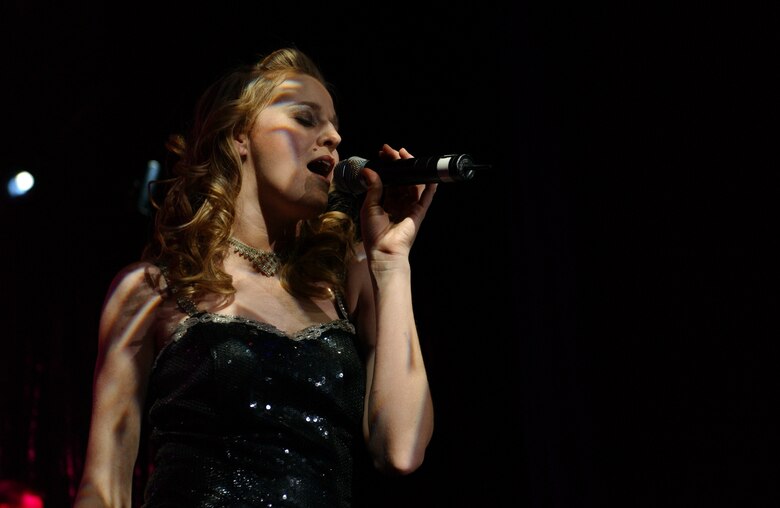 EIELSON AIR FORCE BASE, Alaska --The Tops in Blue world tour 2006 performs "what's love?" in Eielson AFB's Theatre on Jan. 12.  Their performance ushers in lively show tunes, country love, old time favorites, and today's hits in a classic fashion. The Air Force's Expeditionary Entertainers evoke one to reminise the power of love for family, their country, and that 'special someone'.
(U.S. Air Force photo by Senior Airman Rachel Walters)