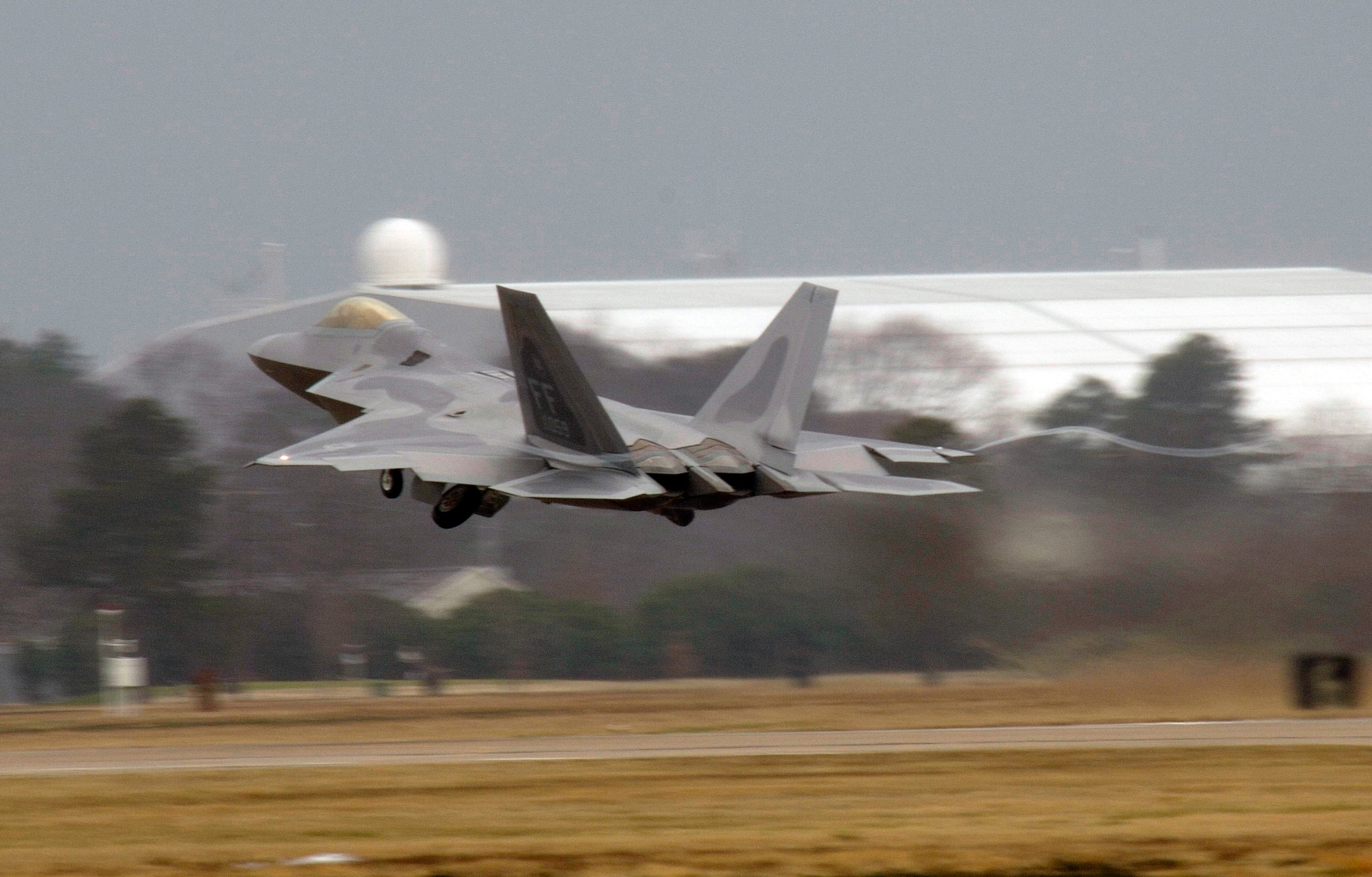 An F-22 Raptor takes off from Langley Air Force Base, Va.  F-22s and Airmen from Langley's 27th Fighter Squadron are deploying to the Pacific in February. (U.S. Air Force photo/Staff Sgt. Samuel Rogers) 