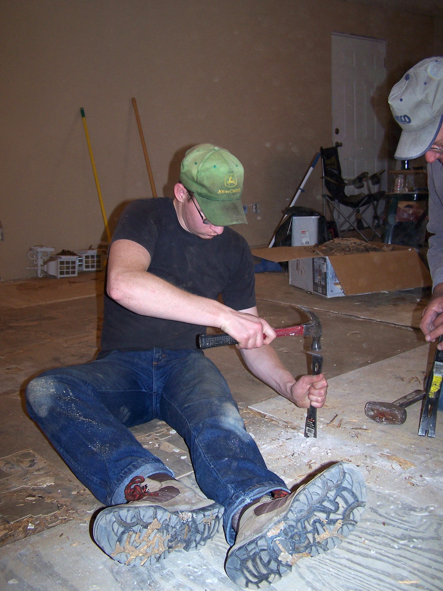 Airman 1st Class Derek Bartholic works on restoring sub-flooring in a house in Bay St. Louis, Miss. The home was damaged by Hurricane Katrina more than a year ago. Airman Bartholic is a maintenance specialist assigned to the 354th Aircraft Maintenance Squadron from Eielson Air Force Base, Alaska. He was one of five Airmen who travelled from Eielson AFB to the Gulf coast to repair Hurricane Katrina-damaged homes. (U.S. Air Force photo/Senior Airman Anthony Nelson)