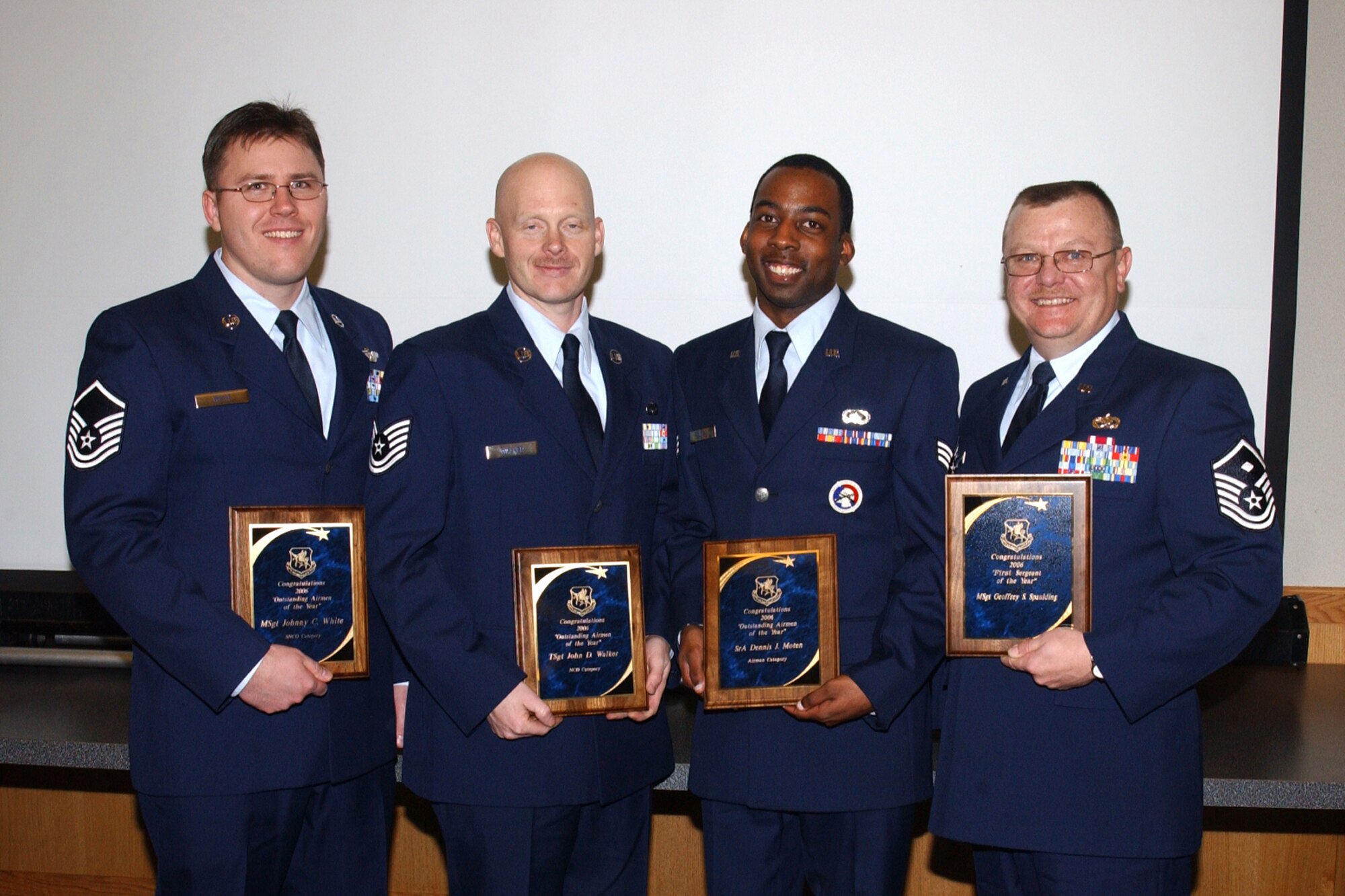 Four outstanding 927th Air Refueling Wing (Air Force Reserve) Airmen were selected from among their peers to represent the wing in further Air Force Reserve competition. Pictured from the left, Master Sgt. Johnny White, Senior NCO of the Year; Tech. Sgt. Albert Walker, NCO of the Year; SrA Dennis Moten, Airman of the Year and Master Sgt. Geoffrey Spaulding, First Sergeant of the Year.                             