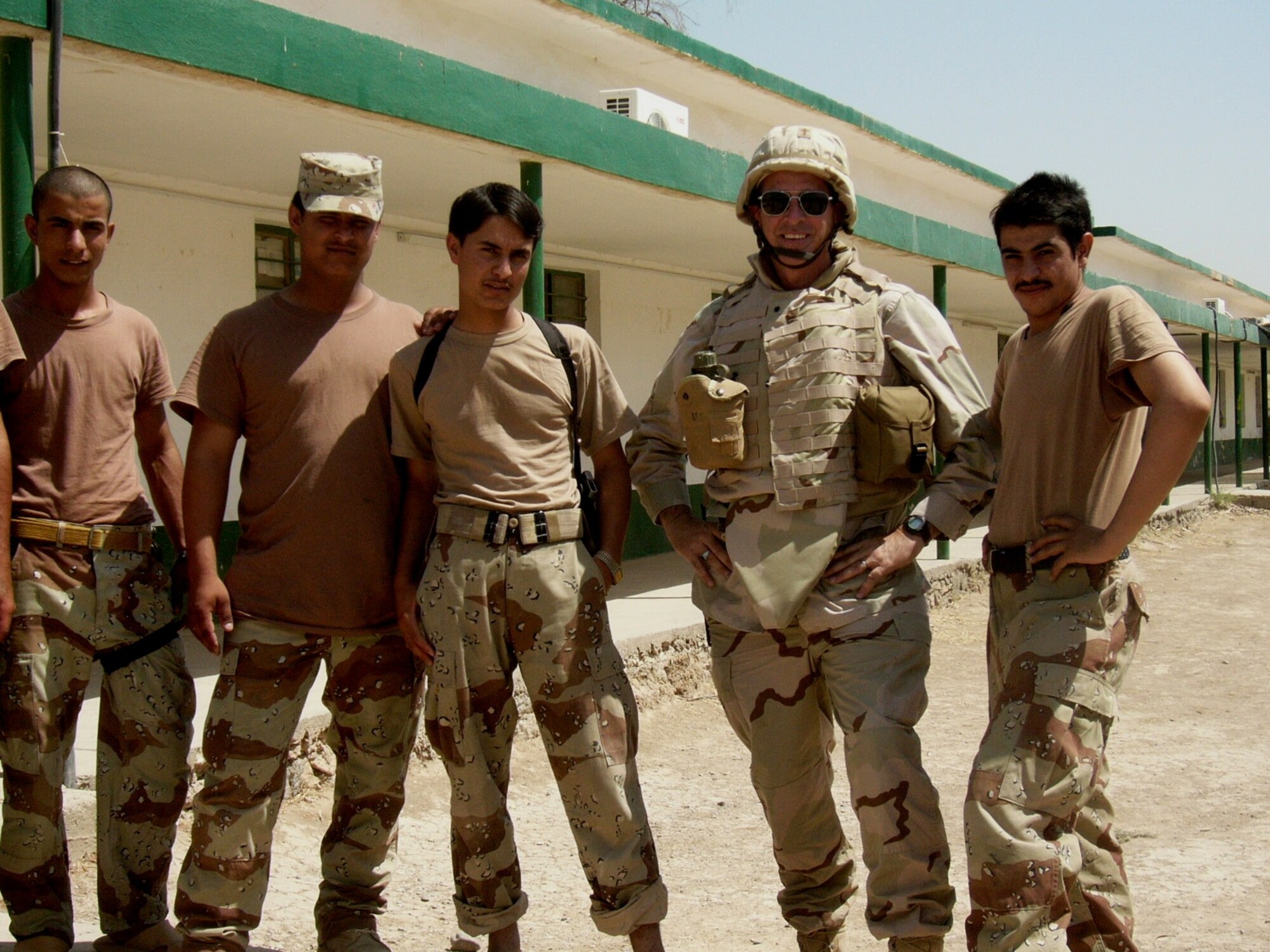 Lt. Col. Fulton poses for a photo with Iraqi soldiers during his deployment to Iraq.