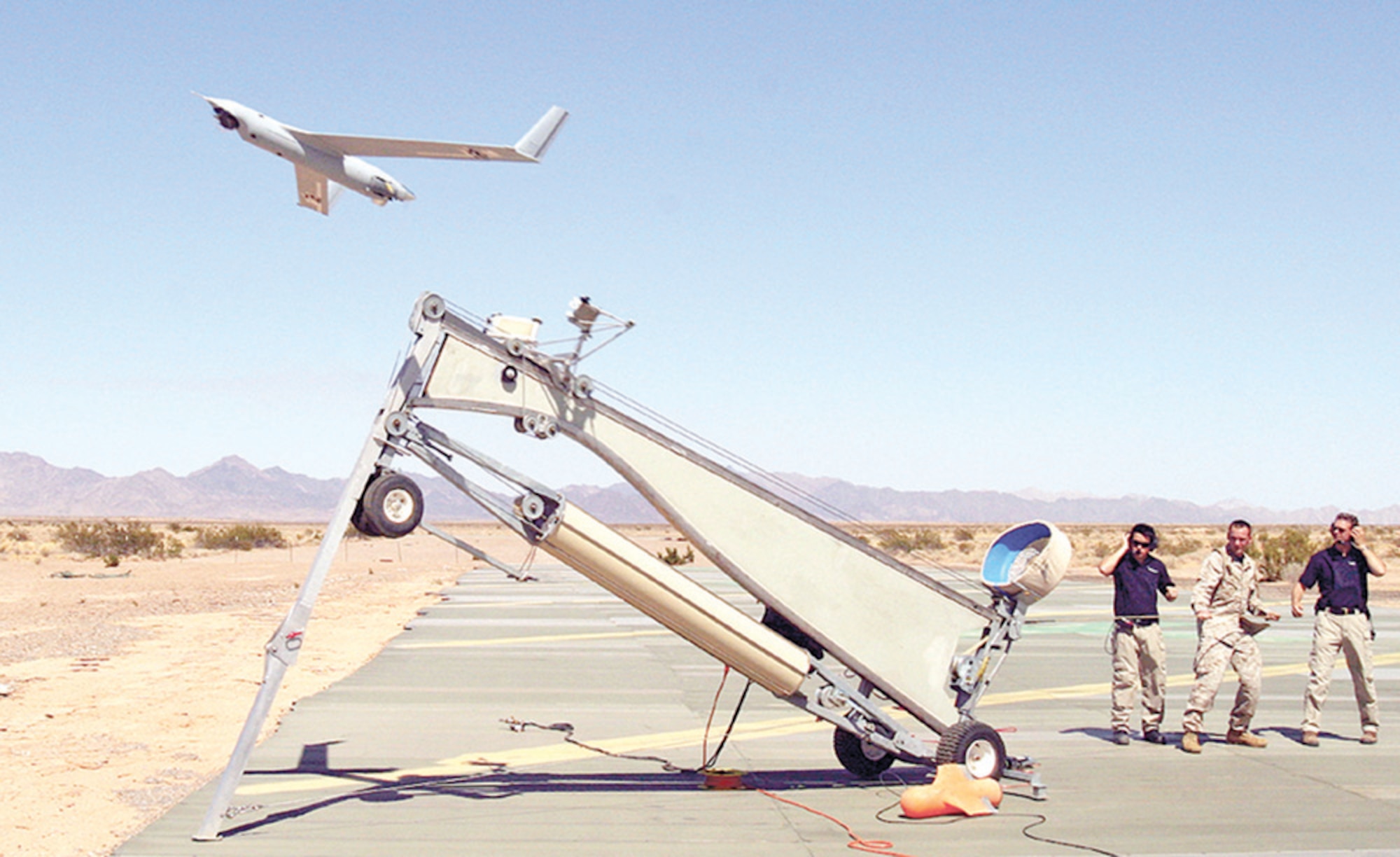 Sgt. Michael Kropiewnicki, U.S. Marine Corp combat videographer, launched a Scan Eagle unmanned aerial vehicle during an exercise at Yuma, Ariz., in 2006. The 820th Security Forces Group will begin using Scan Eagle as part of a user evaluation of the Ground Situational Awareness Toolkit in March. (U.S. Marine Corps photo by  by Sgt. Guadalupe Deanda)