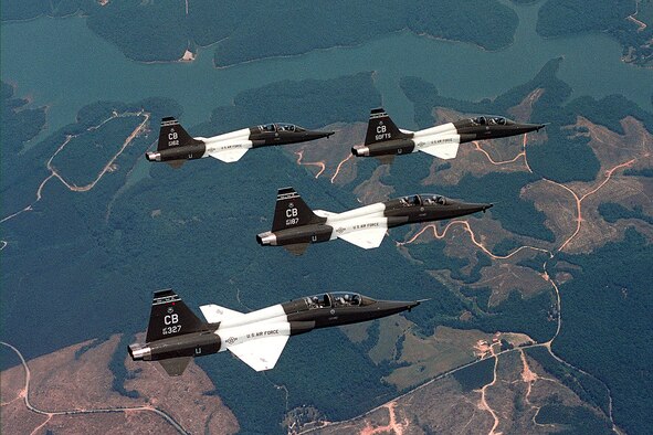 Four T-38 Talons fly in formation. T-38s are twin-engine, high-altitude, supersonic jet trainers used by the 50th Fighter Training Squadron, Columbus Air Force Base, Miss., in a variety of roles because of its design, economy of operations, ease of maintenance, high performance and exceptional safety record. Primarily Air Education and Training Command officials use the aircraft for undergraduate pilot and pilot instructor training. Student pilots fly the T-38 to learn supersonic techniques, aerobatics, formation, night and instrument flying and cross-country navigation. More than 60,000 pilots have earned their wings in the T-38. (U.S. Air Force photo/Senior Airman Matthew C. Simpson)