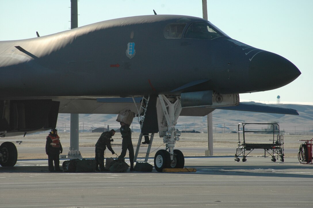 Ellsworth Airmen load a B-1 as the first part of the aviation package prepares to deploy to Southwest Asia. By the end of January, Ellsworth will send more than 400 members in support of the global war on terrorism. (U.S. Air Force photo/Airman 1st Class Kimberly Moore Limrick)