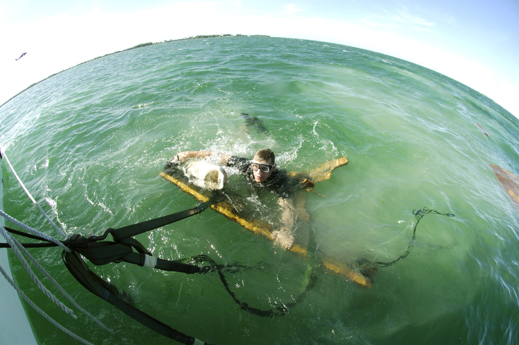 Staff Sgt. William Lawson, 38th Rescue Squaron pararescueman, gains control of a protective sled used in the airdrop of the Hard Duck off the coast of Key West, Fla. An H-Duck is a fully-inflated zodiac raft that is dropped out of an HC-130 and can help PJ’s save valuable time during rescue efforts in the water. The 71st and 38th Rescue Squadrons also combined efforts to test the advanced rescue craft process, which involved deploying a personal watercraft. (U.S. Air Force photo Senior Airman Javier Cruz)
