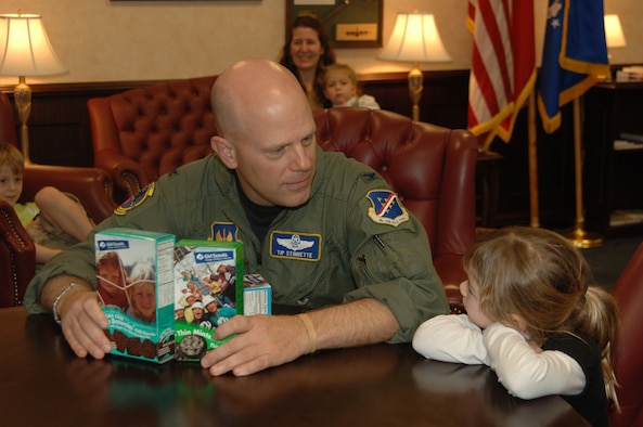 Col. "Tip" Stinnette, 39th Air Base Wing commander, listens to Lauren McMath, a Girl Scout with troop 52, explain why he should buy Girl Scout cookies, Jan. 19. Girl Scout cookies go on sale Jan. 20 at the Base Exchange and the Shoppette from noon to 6 p.m. and Jan. 21 at the Base Exchange from noon to 6 p.m. Cookies are $3.50 a box and the Girl Scouts have a limited supply. 