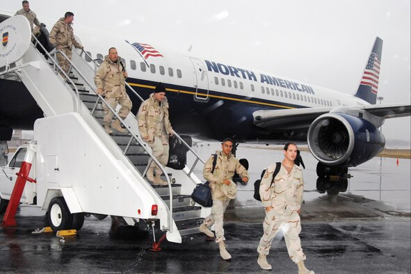 Members of the 55th Wing arrive home to Offutt Dec. 20 in time for the holidays after being deployed to Southwest Asia in support of the war on terrorism. U.S. Air Force Photo by Josh Plueger