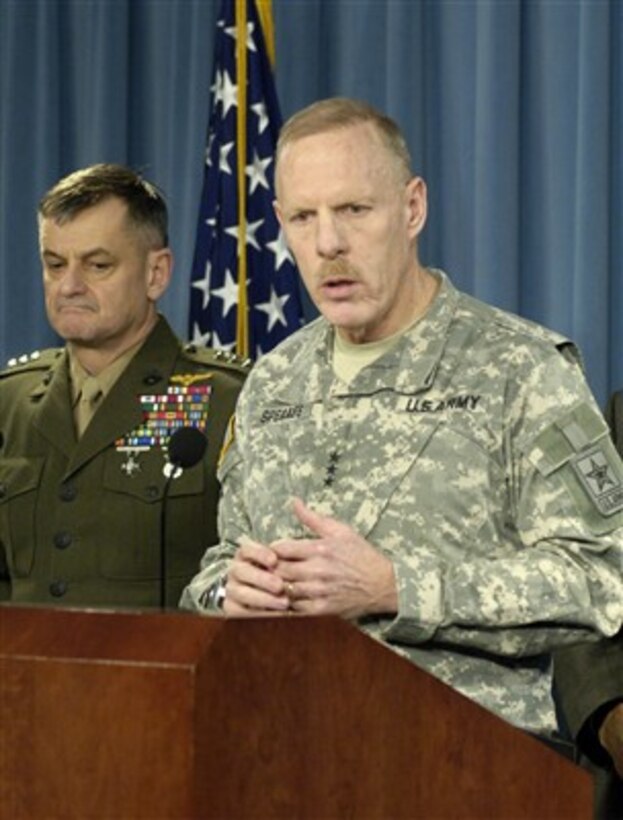 Director of the Army's Force Development Office and Deputy Chief of Staff Lt. Gen. Stephen M. Speaks (right) clarifies an issue for a reporter during a Jan. 19, 2007, Pentagon press briefing on new policies regarding the frequency and duration of National Guard and Reserve forces mobilizations.  Speaks joined Marine Corps Lt. Gen. Emerson N. Gardner Jr. (left) and Under Secretary of Defense for Personnel and Readiness David Chu in explaining the new policies instituted by Secretary of Defense Robert M. Gates.  
