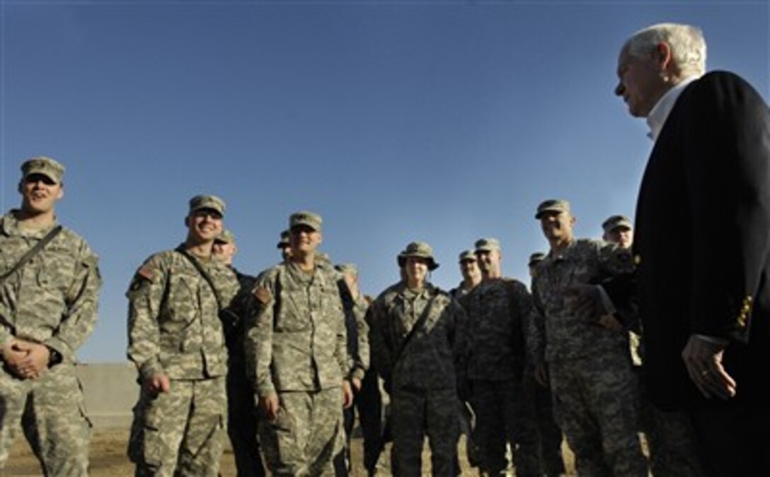 U.S. Defense Secretary Robert Gates meets with soldiers from the Minnesota Army National Guard following a meeting with Gen. George Casey, commander of Multi-National Forces-Iraq, and coalition commanders in Talil, Iraq, Jan. 19, 2007. 