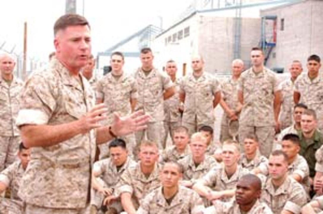 Maj. Gen. Terry G. Robling, 3rd Marine Aircraft Wing commanding general, congratulates the Marines of Marine Attack Squadron 311 for receiving a Chief of Naval Operations Aviation Safety Award Sept. 20 here outside the VMA-311 hangar. Robling, who assumed command of the MAW in July, was visiting the Marine Aircraft Group 13?s aircraft and support squadrons to familiarize himself with the Marines he leads.